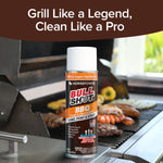 A bottle of Bull Shot BBQ cleaner stands in front of a grill sizzling with assorted meats and vegetables. Above it, text declares: Grill Like a Legend, Clean Like a Pro.